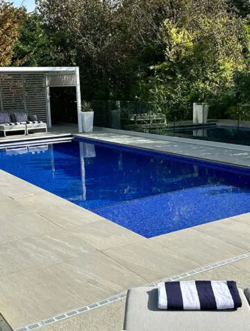 Poolcraft Ltd -Luxury outside pool with Kandla Grey Moderno Porcelain Tile Surround